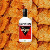 Bottle of Doritos® x Empirical alcohol over backdrop image of Doritos.