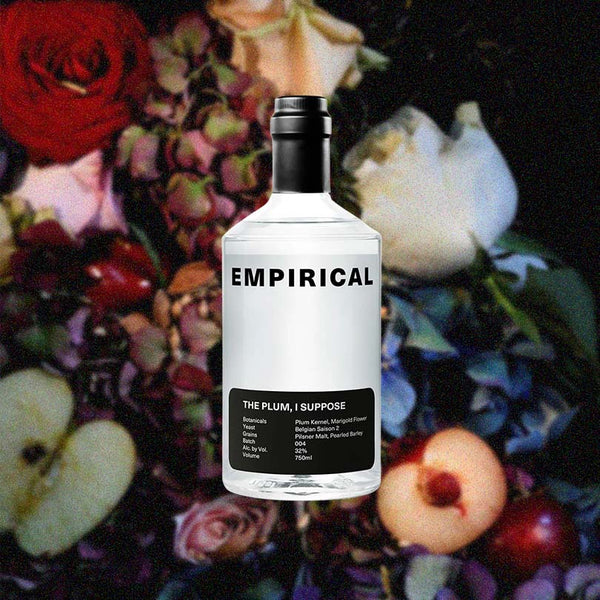Bottle of Empirical The Plum, I Suppose over backdrop image of flowers.