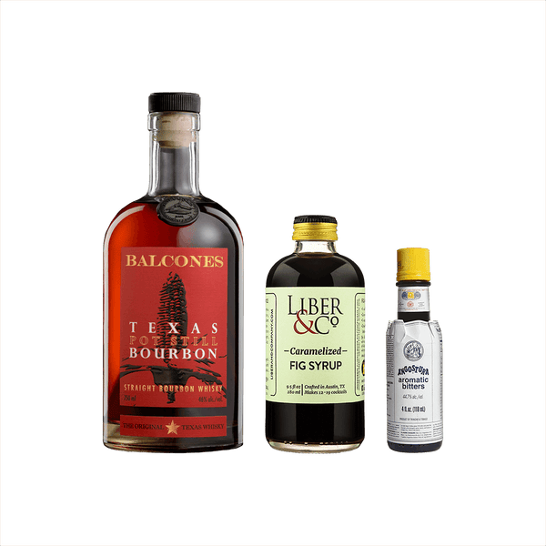 Bottles of Balcones Texas Pot Still Bourbon, Liber & Co. Caramelized Fig Syrup, and Angostura Aromatic Bitters.