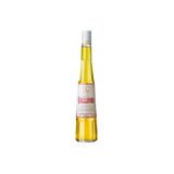 A bottle of Galliano Authentico, yellow in color, tall and elongated shape with the brand name: Galliano, in red script