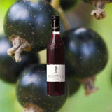 Bottle of Giffard Cassis Noir de Bourgogne over backdrop image of a dark fruit up close.