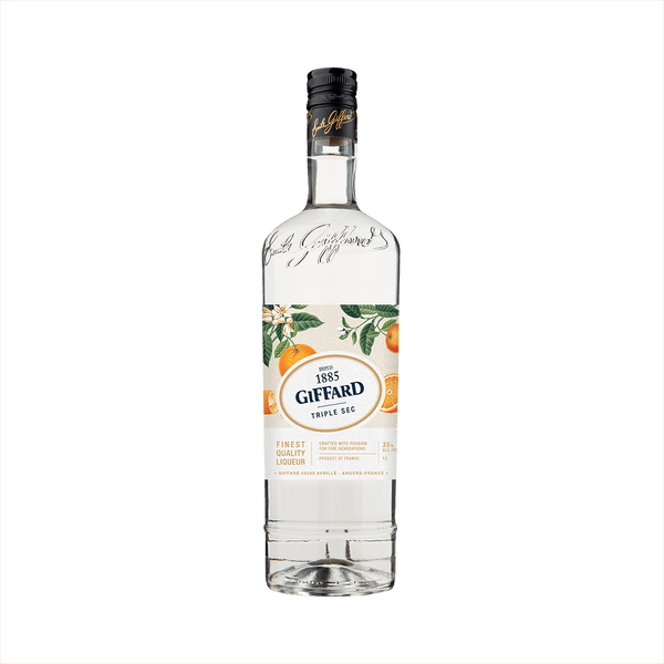 A clear tall bottle of triple sec with a beautifully illustrated label featuring oranges and orange leaves. The label reads 1885 Giffard Triple Sec