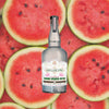 Gin Lane 1751 bottle with watermelon slices in the background