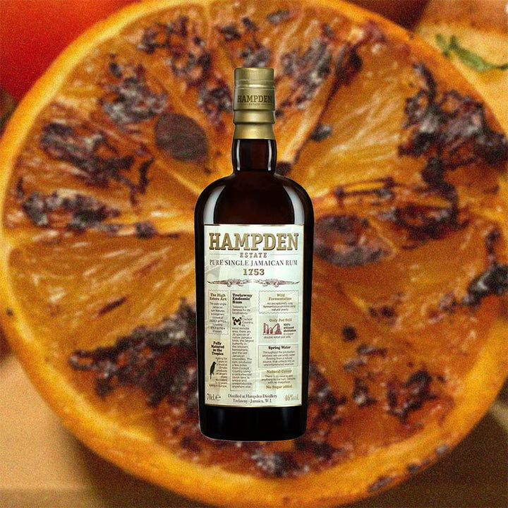 Hampden rum bottle on a sliced orange background