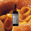 Bottle of Hampden Estate Pagos 100% Ex-Sherry Cask Rum over backdrop or orange gel like substance.
