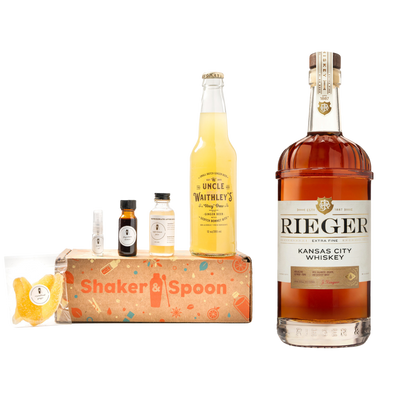 Bottle of Rieger Kansas City Whiskey next to ingredients for cocktail making. product image