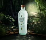 Bottle of Kota Pandan Liqueur in a forest setting