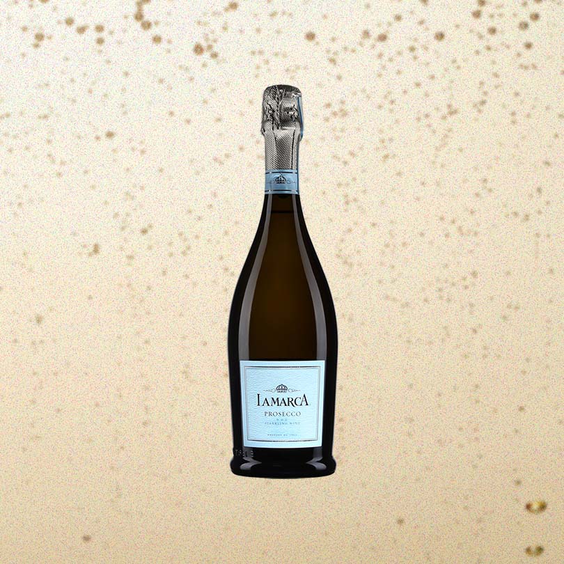Bottle of La Marca Prosecco over back drop of Champagne bubbles.