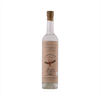 A tall thin bottle of mezcal with a craft paper label that reads: La Puritita Verda from Pierde Almas.  There's an illustration of a winged devil like creature diving into an agave plant.