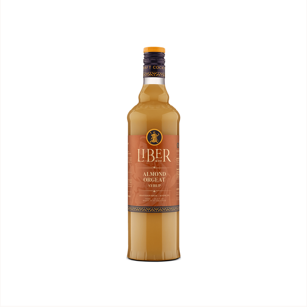 A bottle of Liber & Co. Almond Orgeat Syrup with a label showcasing the brand and product name, set against a plain background.