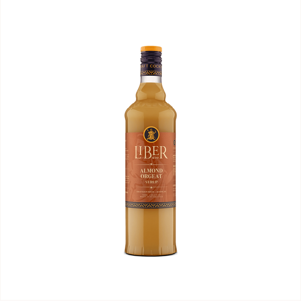 A bottle of Liber & Co. Almond Orgeat Syrup with a label showcasing the brand and product name, set against a plain background.