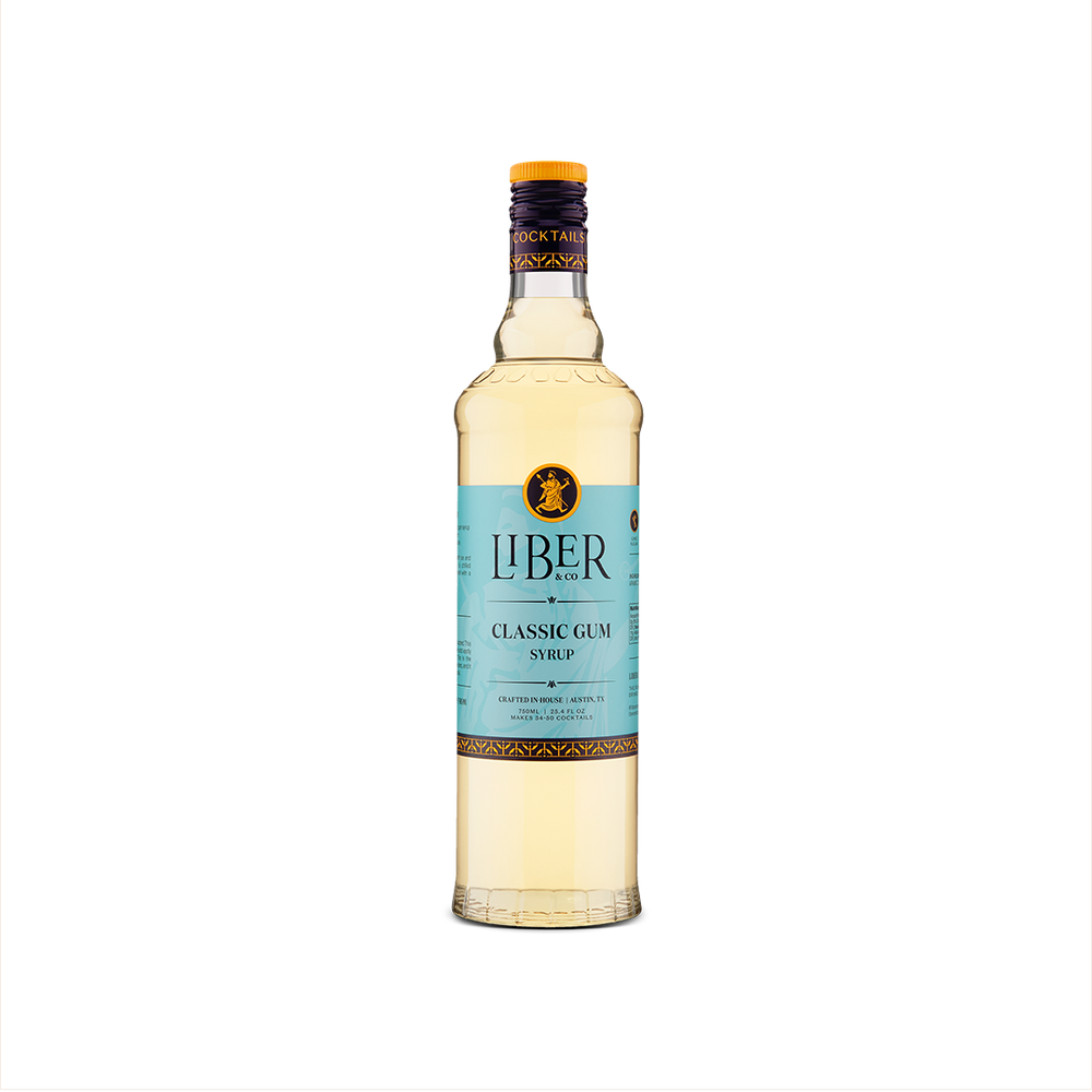 A bottle of Liber & Co. Classic Gum Syrup with a label in shades of blue and white, displaying the brand name and product name.