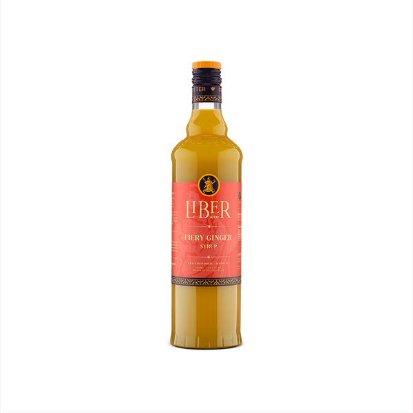 Bottle of fiery ginger syrup with a red label on a white background
