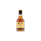 Bottle of Liber Cinnamon Syrup on a white background