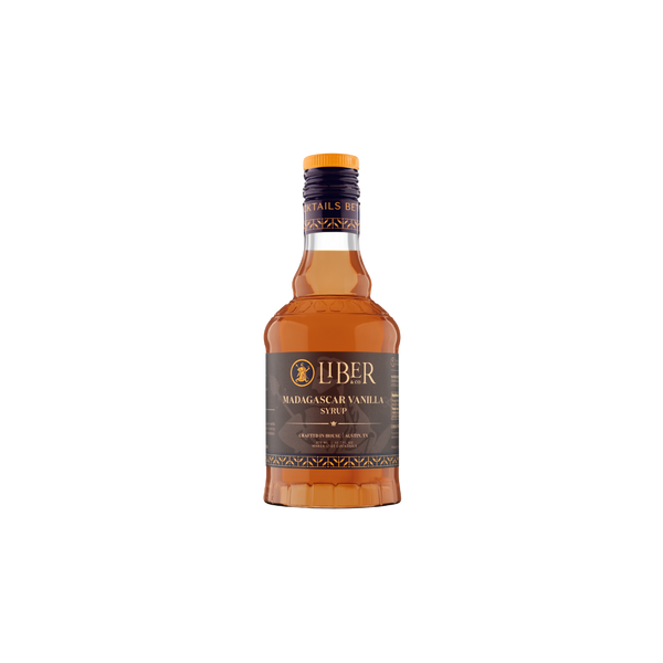A bottle of Liber Madagascar Vanilla Syrup with amber-colored liquid, a dark brown label, and a gold cap, centered on a plain white background.