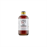 A small premium bottle of warm red liquid, the label reads: Liber & Co Old Fashioned Cocktail Syrup