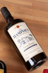 Bottle of Hampden rum on a wooden surface