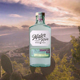 Bottle of Mater Sicilian Sugarcane Rum Purple Cane Batch 1 over backdrop image of mountains.