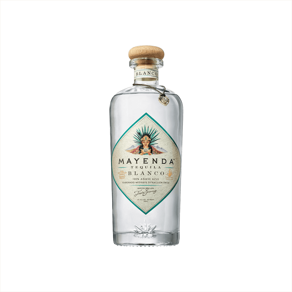 A premium bottle of clear tequila with a wood stopper. The label is diamond shaped with a teal edge, and it reads: Mayenda Tequila Blanco. 100% Agave Azul.