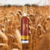 Penelope Wheated Straight Bourbon Whiskey over backdrop image of wheat.