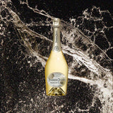 Bottle of Perrier Jouet Blanc De Blancs Champagne over back drop image of champagne flying into the air!