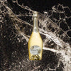 Bottle of Perrier Jouet Blanc De Blancs Champagne over back drop image of champagne flying into the air!