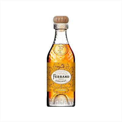 A bottle of Pierre Ferrand Cognac Ambre with a clear amber-colored liquid visible and the brand's logo on the label.