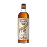 Bottle of Ferrand Dry Curacao liqueur with a visible label on a green background