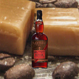 Bottle of Planteray Overproof O.F.T.D. Rum  - formerly Plantation. 1 L. Against a backdrop of caramel and coffee beans.