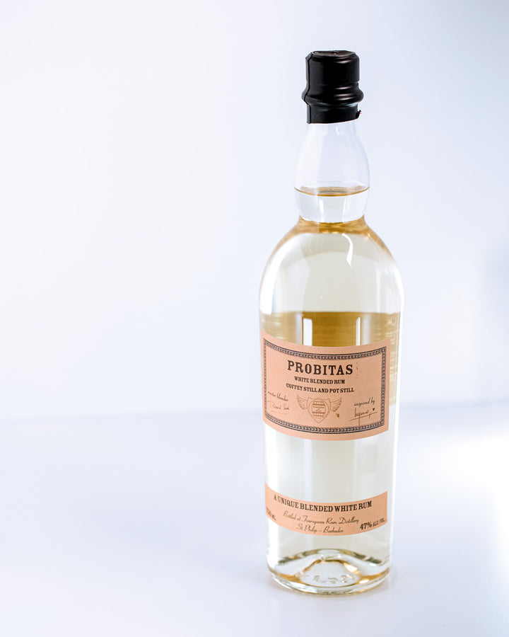 Bottle of Probitas white rum on a white background