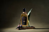 Bottle of The Lost Explorer Reposado Tequila with an olive, dark background.