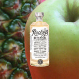 Bottle of Rockey’s Botanical Liqueur over back drop image of a green apple.