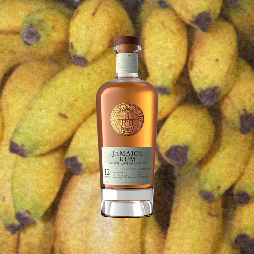 Bottle of Jamaica Rum in front of a background of bananas