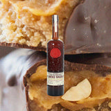 Bottle of Smokey Wagon whiskey with a background of food items