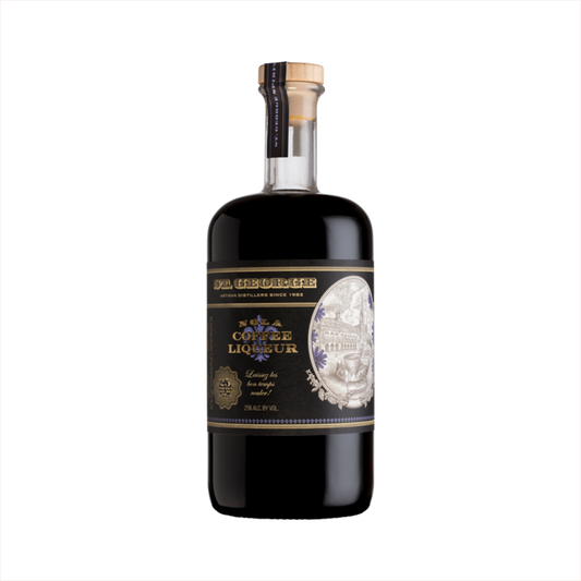 A dark rich liquid in a beautiful, apothecary shaped bottle. The label reads NOLA Coffee Liqueur. There's a sepia toned illustration of an old style Spanish buildings in an oval emblem on the bottle.