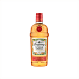 A lovely bright orange colored glass bottle in the familiar shape of classic Tanqueray gin. The foil cap is red, and the label reads: Tanqueray Sevilla Orange. Orange Flavored Gin.  It is surrounded by a border of illustrated orange slices and orange blossoms.