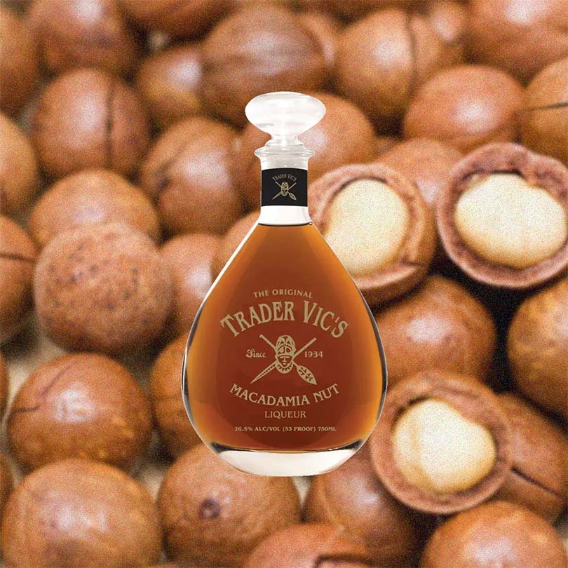 Bottle of Bottle of Trader Vic's Macadamia Nut Liqueur over backdrop image of Macadamia nuts.