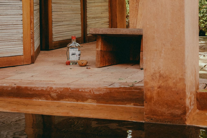 Small bottle on a wooden surface with a rustic background