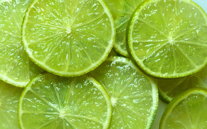 Close-up of sliced limes with a bright green color.