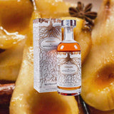 Bottle of Ferrand 10 Generations Cognac over backdrop of candied pears.