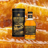 Aberfeldy 12 Single Malt Scotch Whisky over blurry orange backdrop.