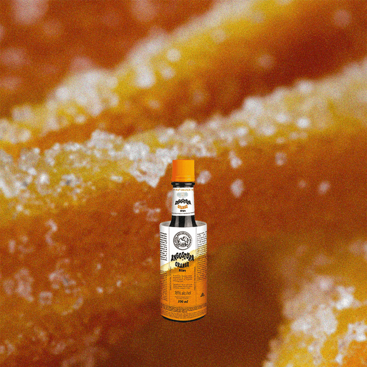 4oz Angostura Orange Bitters over up close orange candy.