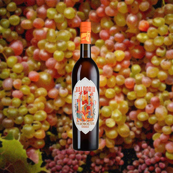 Bottle of Baldoria Orange Wine - 2020 Vintage over background image of grapes.