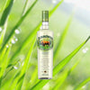 750ml bottle of Zubrowka Bison Grass Vodka over backdrop of green grass.
