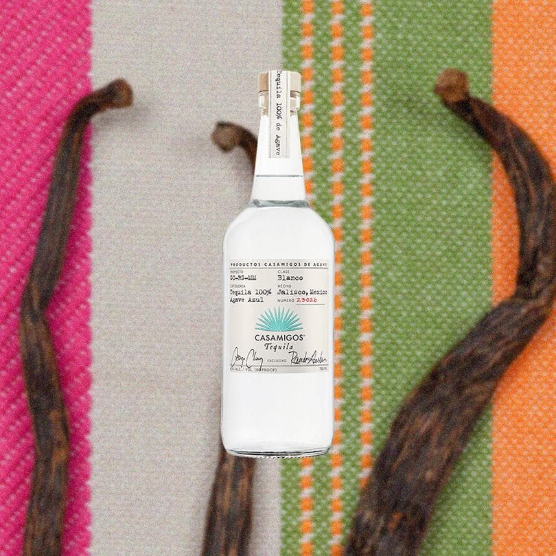 Bottle of Casamigos Blanco Tequila over backdrop of a rug.