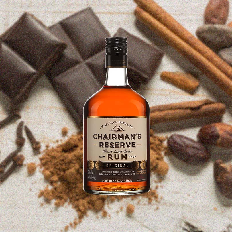 750ml bottle of Chairman's Reserve Original Rum over backdrop of cinnamon sticks, chocolate and coffee beans.