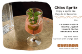 A Chios Spritz in a cocktail glass with a green garnish and accompanying recipe card.