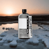 Bottle of The Community Spirit Vodka over backdrop of glacier.