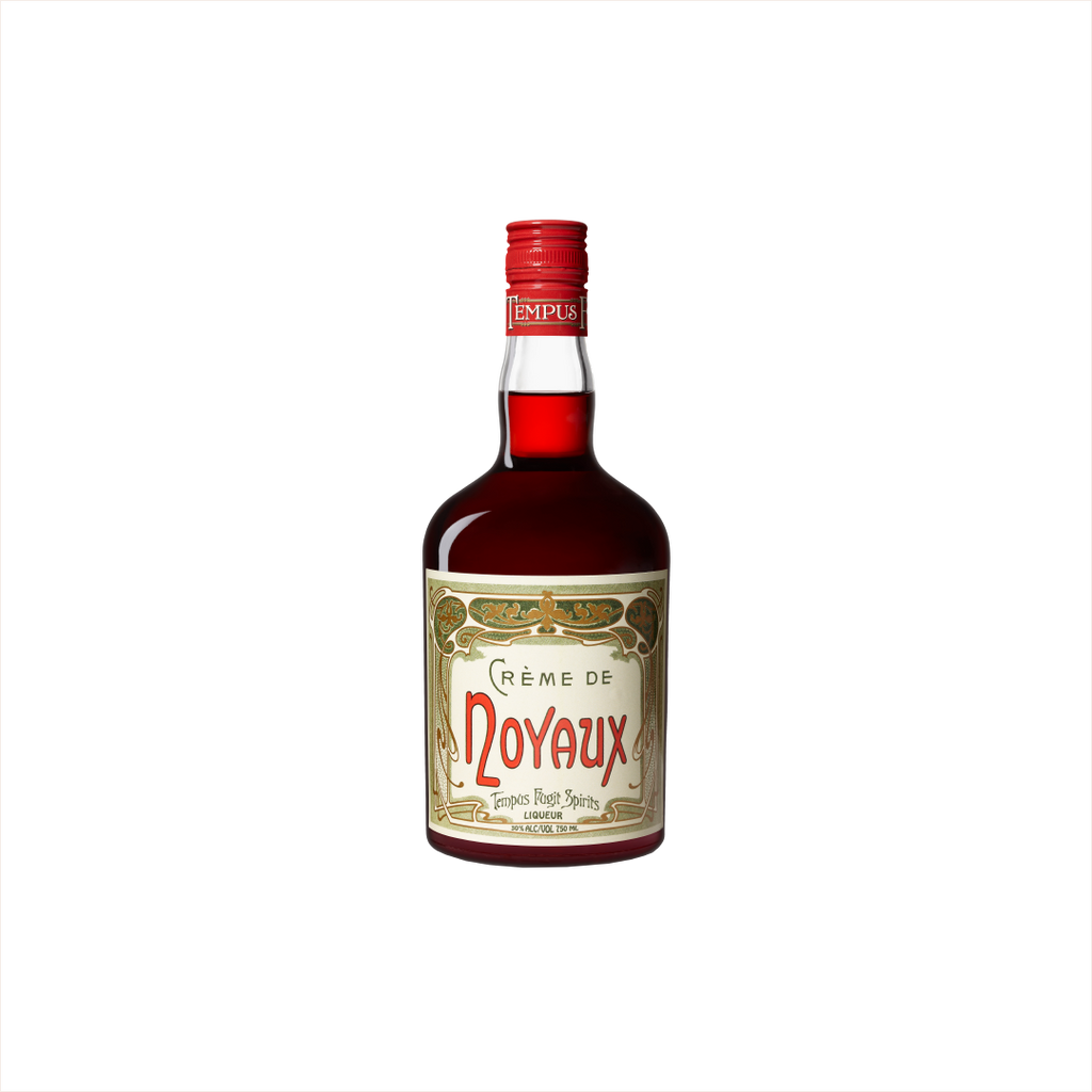Bottle of Tempus Fugit Creme de Noyaux. A bottle with a bright red cap.