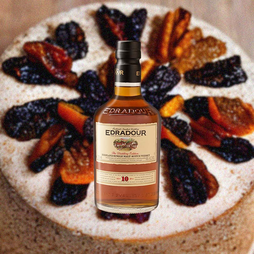Bottle of Edradour 10 Year Old Scotch Whisky over backdrop of image of baked goods.